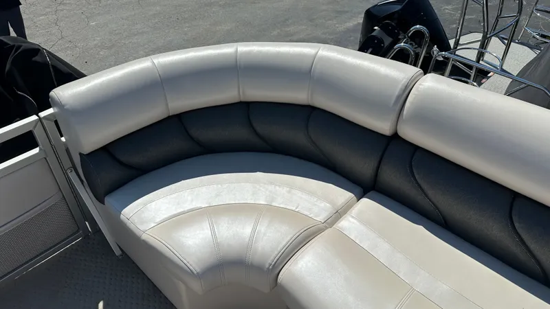 Slide: The Image of The 2008 Manitou Legacy features a curved, cushioned seat in cream and dark gray. - 21