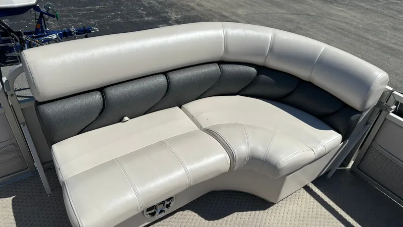 Slide: The Image of The 2008 Manitou Legacy features a sleek, cushioned seating area in light and dark gray tones. - 19