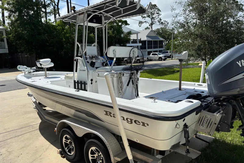 Slide: The Image of 2006 Ranger 2200 Bay Ranger boat on trailer, parked outdoors. - 2