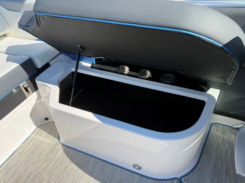 Slide: The Image of An open storage compartment on a 2019 Regal 23 RX Bowrider boat. - 30