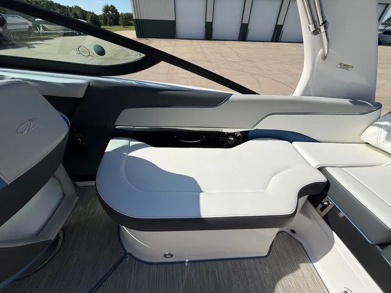 Slide: The Image of Interior view of a 2019 Regal 23 RX Bowrider with sleek white seating. - 28