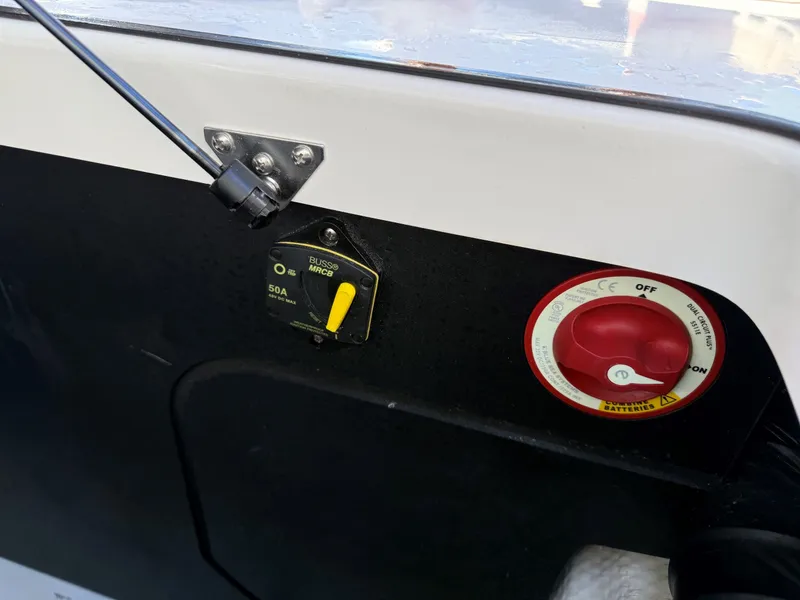 Slide: The Image of Close-up of a switch and a red dial on a boat. - 41