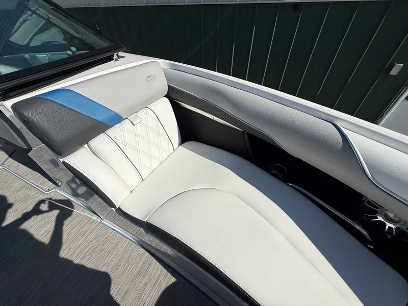 Slide: The Image of Close-up of a boat's white and blue seating area with sleek stitching. - 13