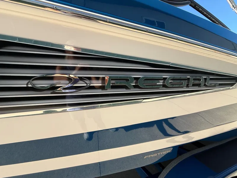 Slide: The Image of Close-up of the Regal logo on a 2019 23 RX Bowrider boat. - 4