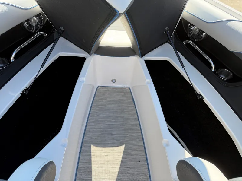 Slide: The Image of Interior view of a 2019 Regal 23 RX Bowrider with open bow cover. - 14