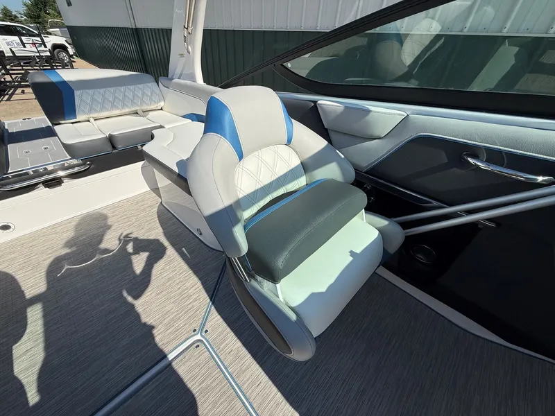 Slide: The Image of Interior of a 2019 Regal 23 RX Bowrider with cushioned seating and modern design. - 24