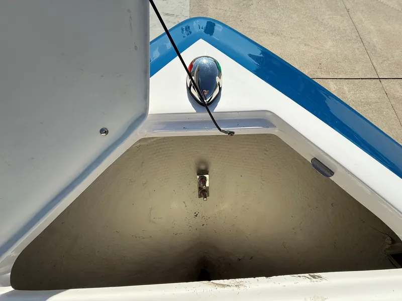 Slide: The Image of Close-up of a storage compartment in the bow of a boat with a blue trim. - 11