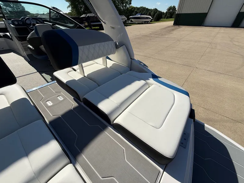 Slide: The Image of The image shows the interior of a 2019 Regal 23 RX Bowrider with white upholstered seating. - 31