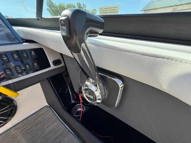 Slide: The Image of Close-up of a boat's throttle lever and controls. - 22