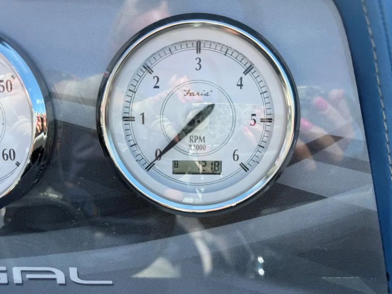 Slide: The Image of Close-up of a tachometer with Regal logo, showing 618 operating hours. - 18
