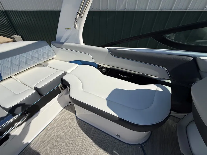 Slide: The Image of Interior of a 2019 Regal 23 RX Bowrider with white upholstery and modern details. - 25