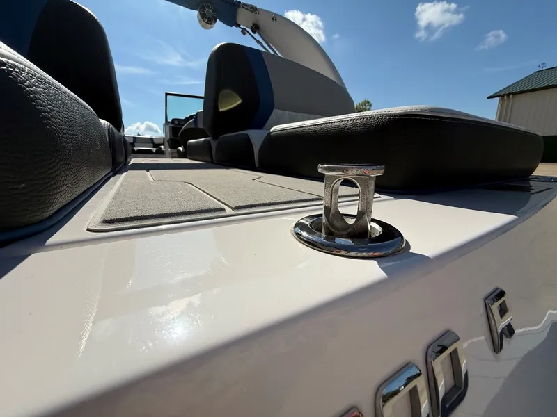 Slide: The Image of Close-up of a 2019 Regal 23 RX Bowrider deck with cushions and a metal fitting. - 38
