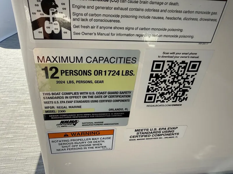 Slide: The Image of Sign showing maximum capacity: 12 persons or 1724 lbs. Includes safety and warning information. - 21