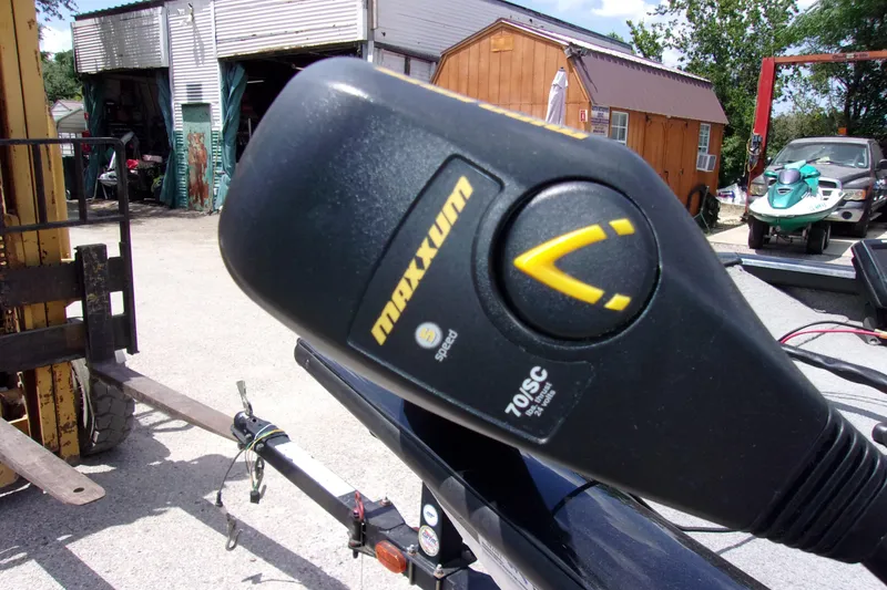 Slide: The Image of Close-up of a Maxxum trolling motor on a 2013 Tracker Pro Team 190 TX boat. - 12