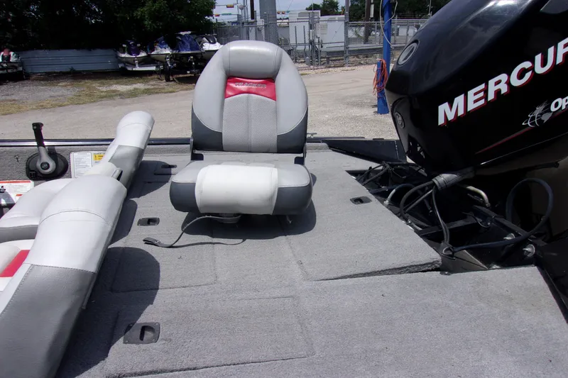 Slide: The Image of 2013 Tracker Pro Team 190 TX boat interior with Mercury outboard motor. - 8