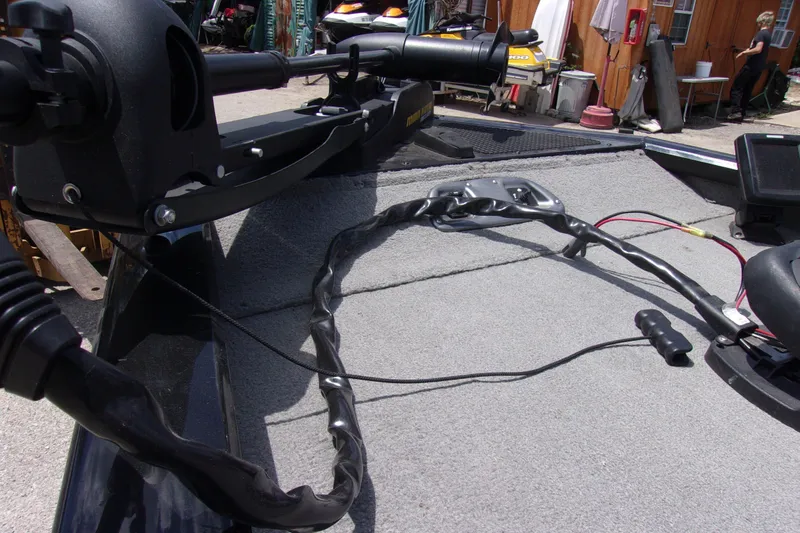 Slide: The Image of 2013 Tracker Pro Team 190 TX boat deck with trolling motor and wiring. - 10
