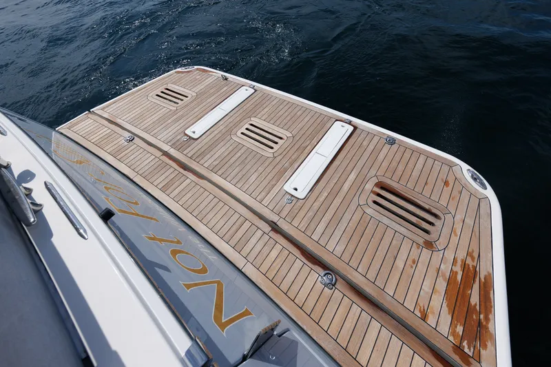 Slide: The Image of Teak deck of 2024 Sabre 48 Salon Express yacht on water. - 13