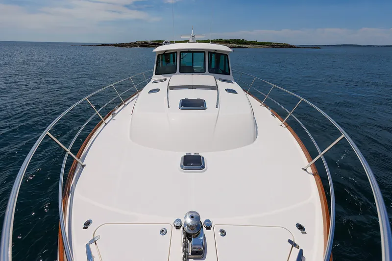 Slide: The Image of 2024 Sabre 48 Salon Express yacht cruising on open water. - 10