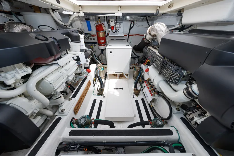 Slide: The Image of Engine room of 2024 Sabre 48 Salon Express, showcasing dual engines and equipment. - 40