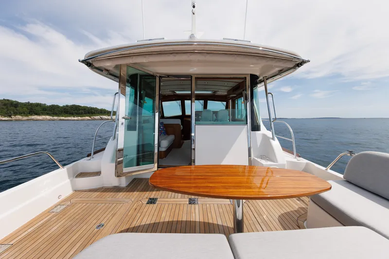 Slide: The Image of 2024 Sabre 48 Salon Express yacht with elegant deck and ocean view. - 11