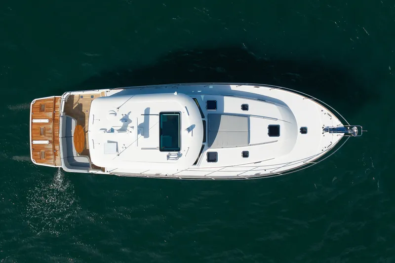 Slide: The Image of Aerial view of 2024 Sabre 48 Salon Express yacht cruising on open water. - 5
