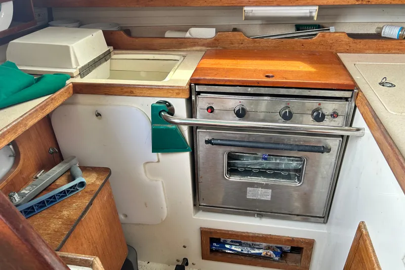Slide: The Image of Galley kitchen in 1998 Catalina 36 MkII sailboat with stove and sink. - 43