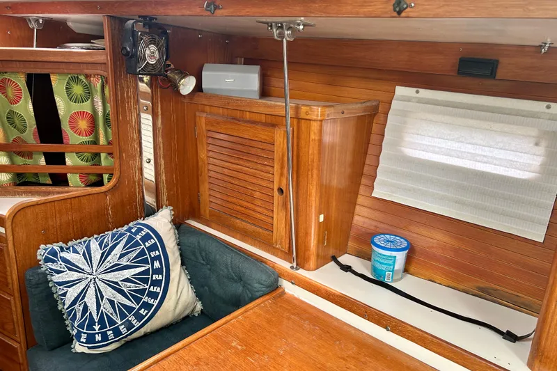 Slide: The Image of Interior of 1998 Catalina 36 MkII sailboat with wooden cabinetry and nautical decor. - 59