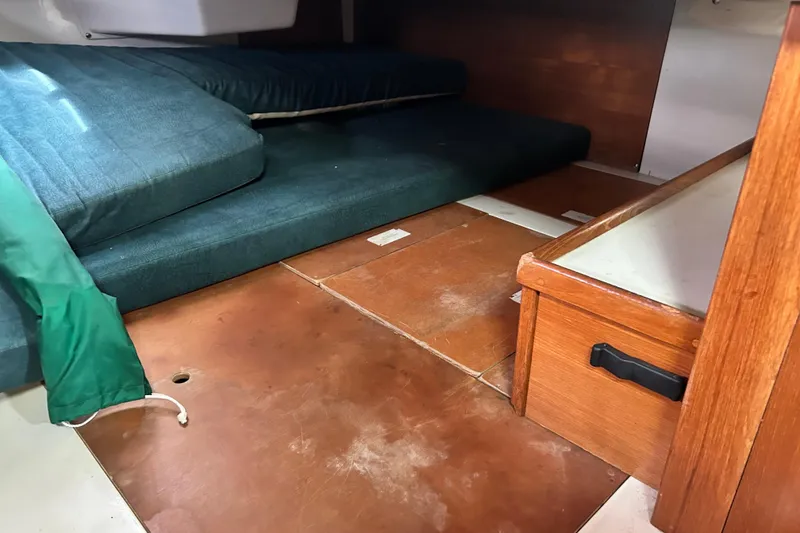 Slide: The Image of Interior cabin of a 1998 Catalina 36 MkII sailboat with cushions and wooden flooring. - 47