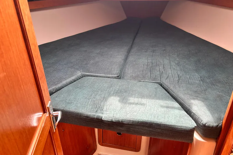 Slide: The Image of Cozy cabin interior of 1998 Catalina 36 MkII sailboat with cushioned berth. - 72