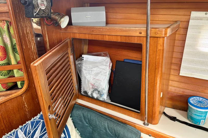 Slide: The Image of Wooden interior of 1998 Catalina 36 MkII sailboat with open cabinet and nautical decor. - 88