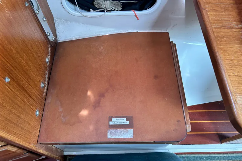 Slide: The Image of Wooden interior of a 1998 Catalina 36 MkII sailboat with storage compartment. - 90