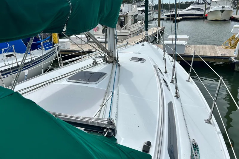 Slide: The Image of Sailboat Catalina 36 MkII 1998 docked at marina with green covers. - 12