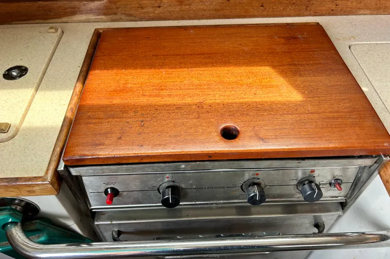 Slide: The Image of Wooden stove cover on a 1998 Catalina 36 MkII yacht kitchen. - 41