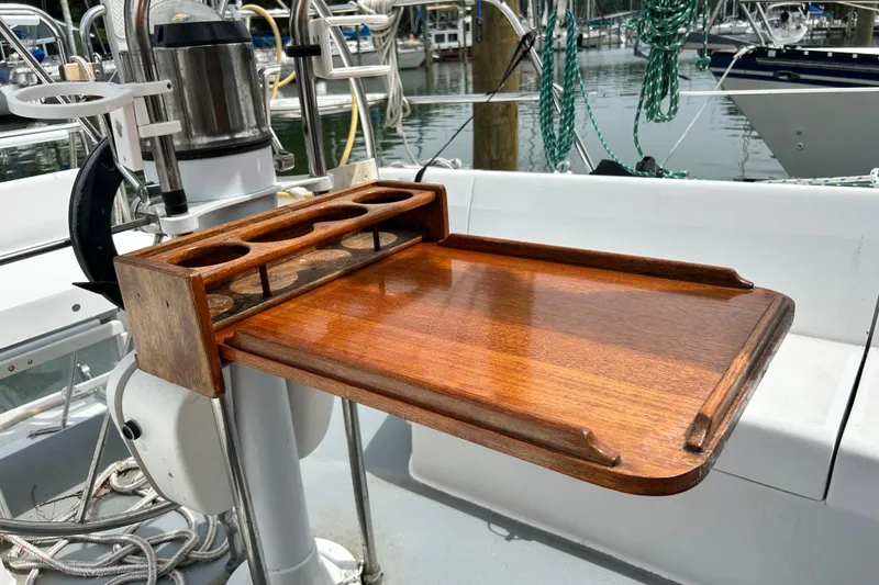 Slide: The Image of Wooden cockpit table on a 1998 Catalina 36 MkII sailboat, docked at a marina. - 28