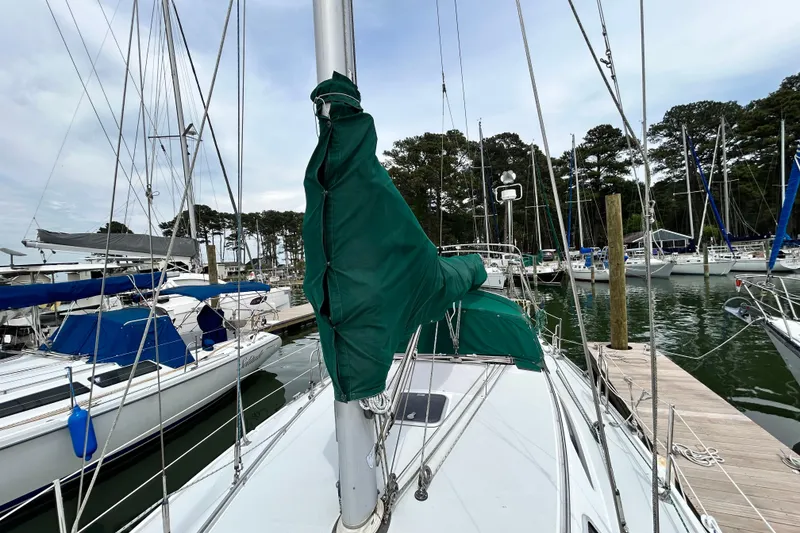 Slide: The Image of Sailboat Catalina 36 MkII, 1998 model, docked at marina with green sail cover. - 11