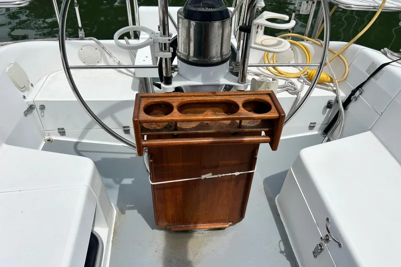 Slide: The Image of Cockpit of 1998 Catalina 36 MkII sailboat with wooden drink holder and steering wheel. - 29