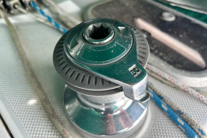 Slide: The Image of Winch on a 1998 Catalina 36 MkII sailboat deck, featuring ropes and metal components. - 32