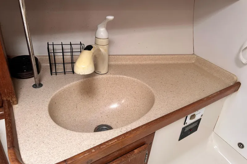 Slide: The Image of Compact sink area in a 1998 Catalina 36 MkII sailboat galley. - 61