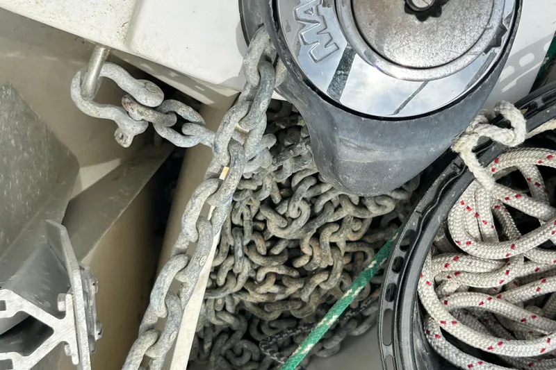 Slide: The Image of Anchor chain and ropes on a 1998 Catalina 36 MkII sailboat deck. - 16
