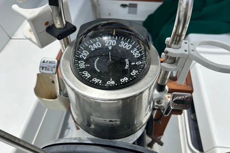 Slide: The Image of Compass and controls on a 1998 Catalina 36 MkII sailboat cockpit. - 23