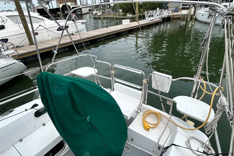 Slide: The Image of Cockpit view of a 1998 Catalina 36 MkII sailboat docked at a marina. - 10