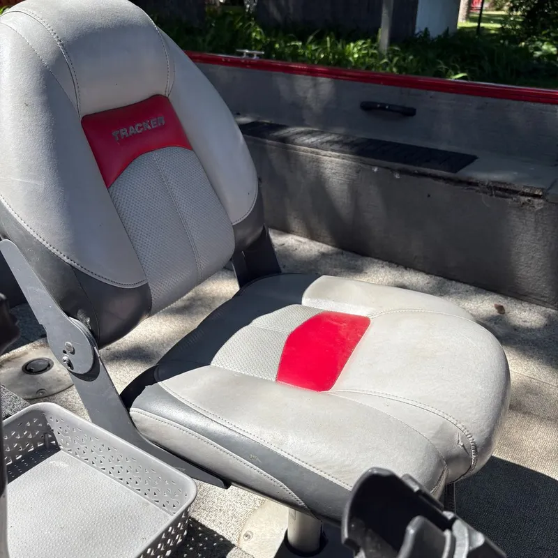 Slide: The Image of A gray and red boat seat in sunlight. - 4