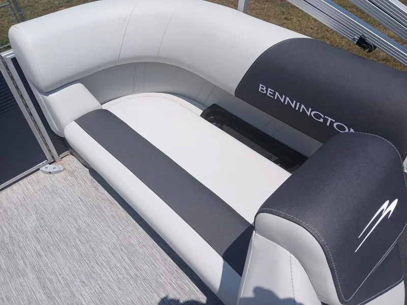 Slide: The Image of The Bennington 20SL features a sleek, cushioned bench seat with gray and white upholstery. - 22