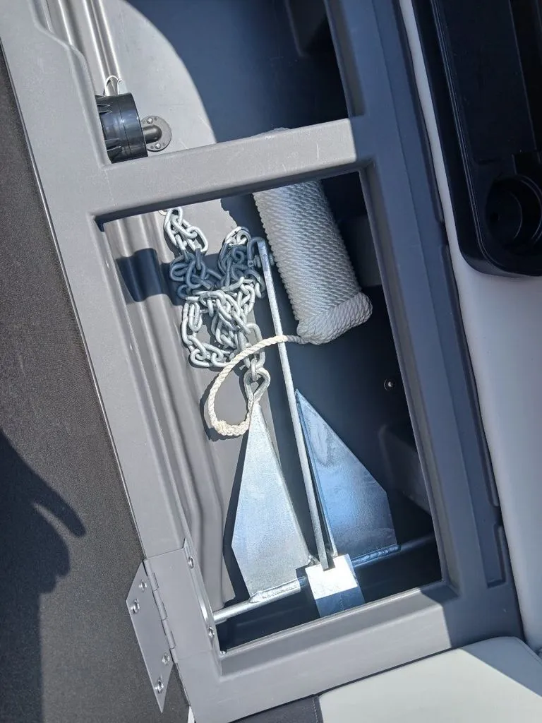 Slide: The Image of An anchor and chain are stored in a compartment on a boat. - 26