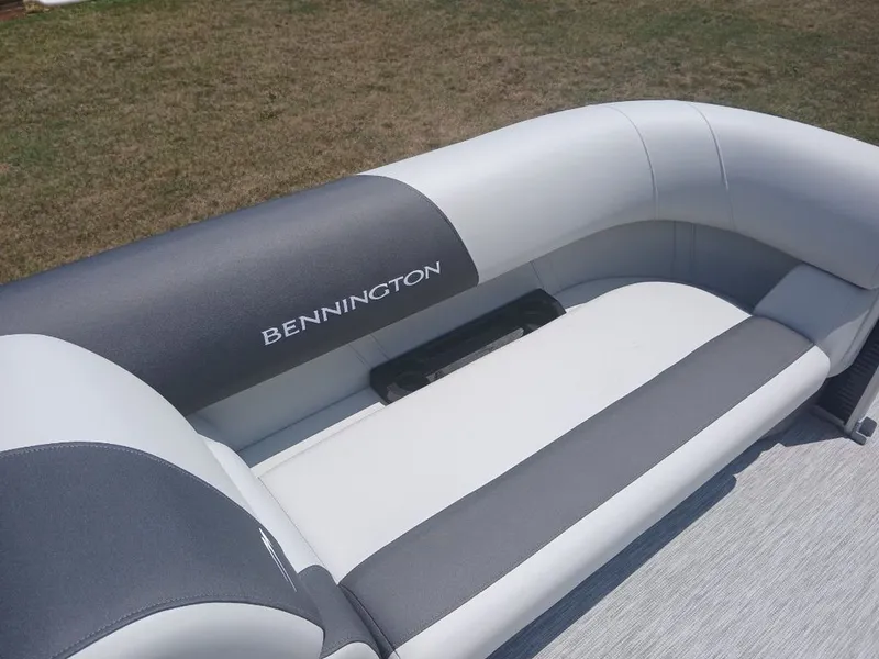 Slide: The Image of The image shows a gray and white bench seat on a Bennington boat. - 19