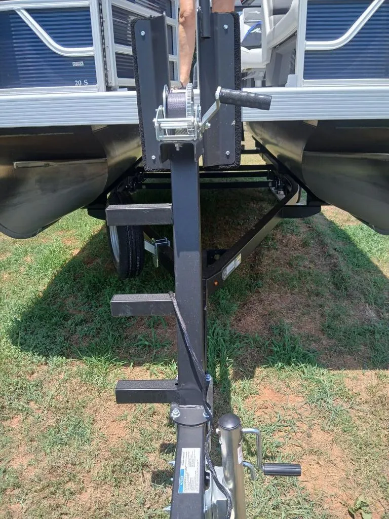 Slide: The Image of Close-up of a boat trailer with a Bennington pontoon boat on it. - 33