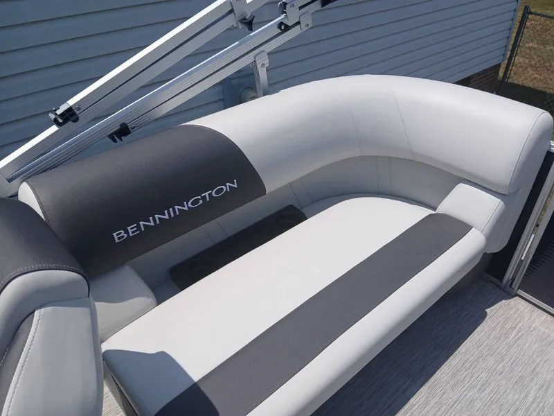 Slide: The Image of The image shows a gray seating area on a Bennington boat. - 20