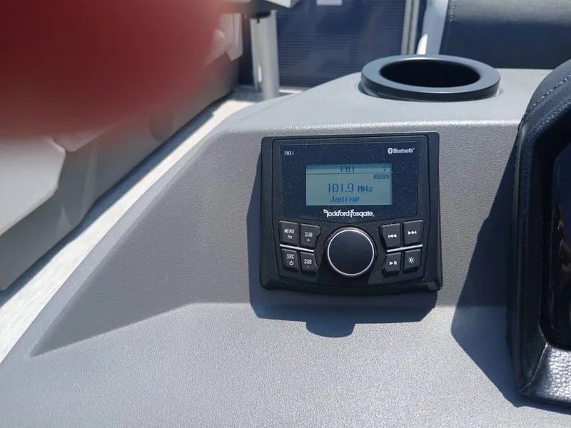 Slide: The Image of Close-up of a boat radio panel with Bluetooth capability. - 10