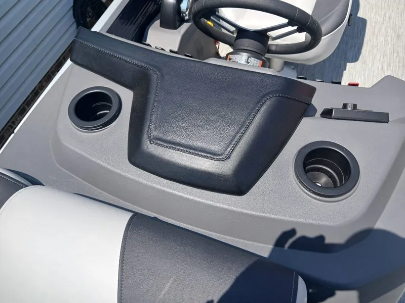 Slide: The Image of Close-up of a Bennington 20SL boat's helm with cup holders. - 14