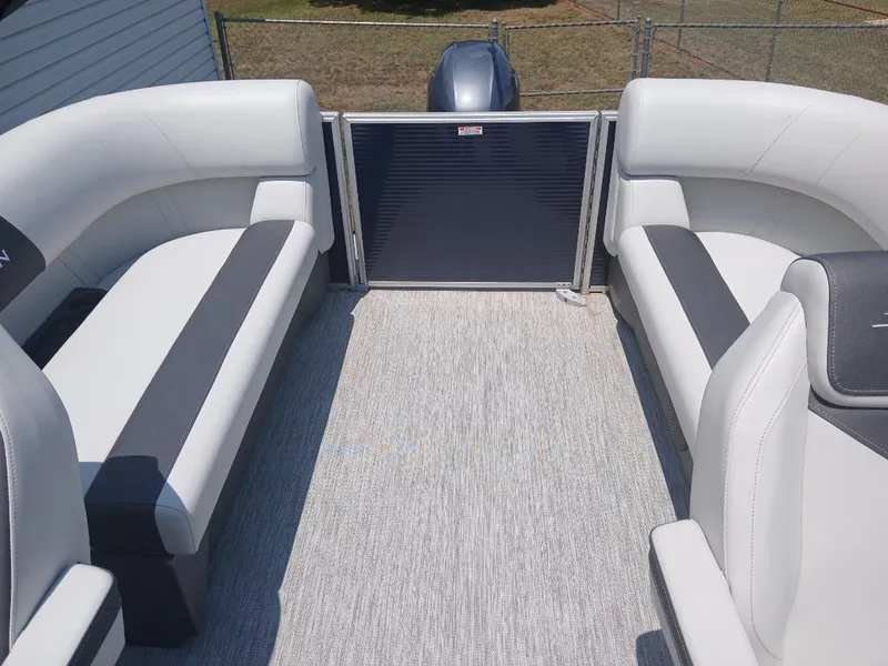 Slide: The Image of Interior of a Bennington 20SL pontoon boat with gray and white seating. - 21